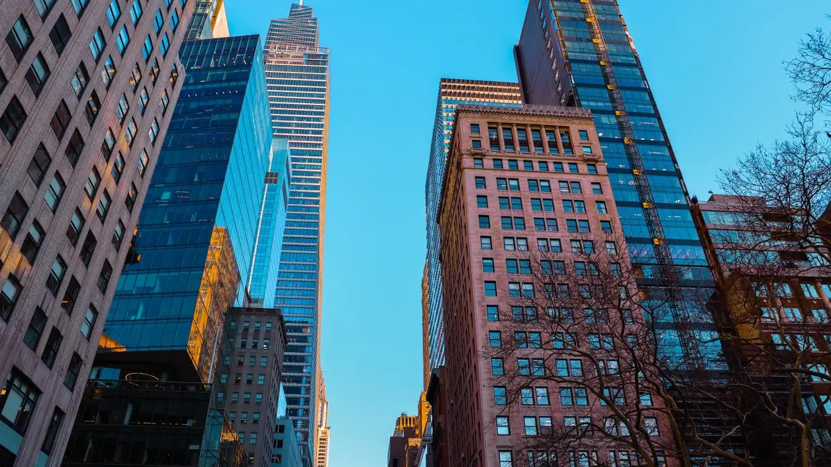 City high-rise buildings seen from street level.