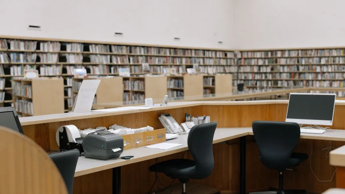 Study desks and bookshelves in a university library.