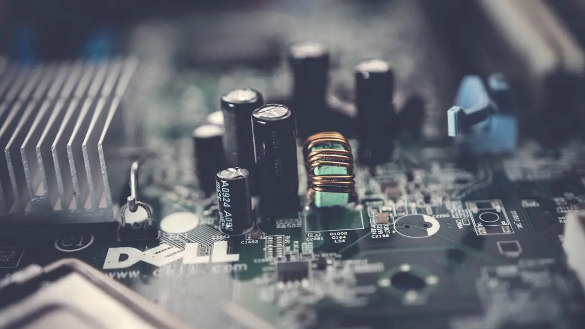 Close-up of capacitors and electronic components on a motherboard.