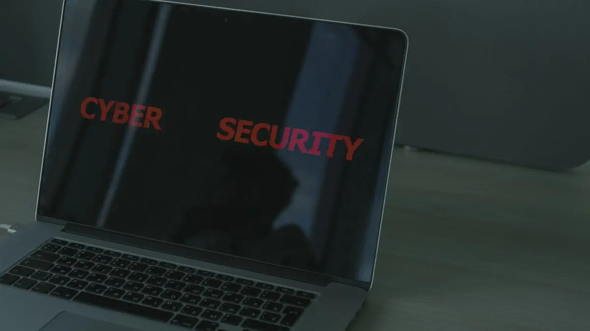 Laptop screen displaying the words cyber security.
