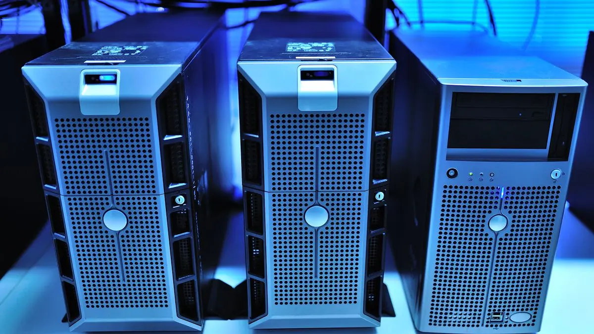 Rack-mounted servers illuminated by blue light.