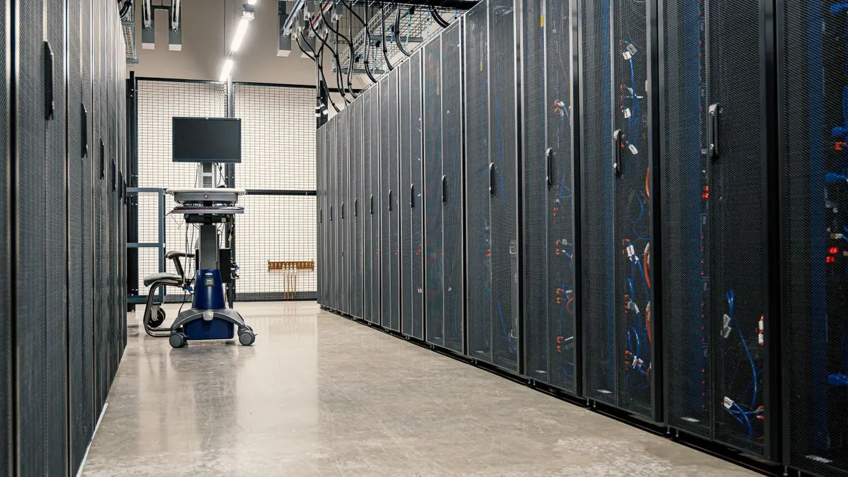 A data-center aisle lined with server racks.